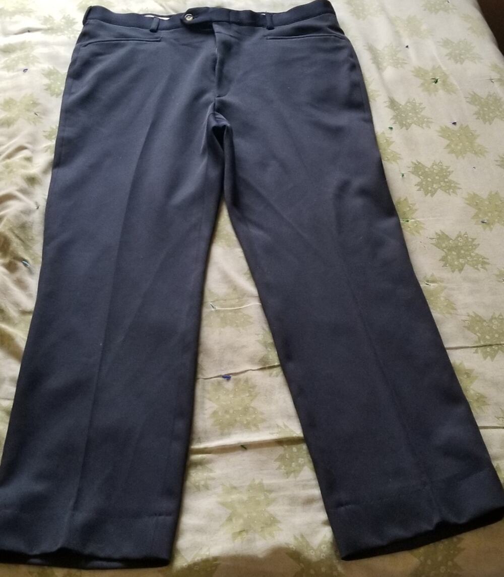 Sansabelt brand men's navy blue dress pants, size and material unknown.